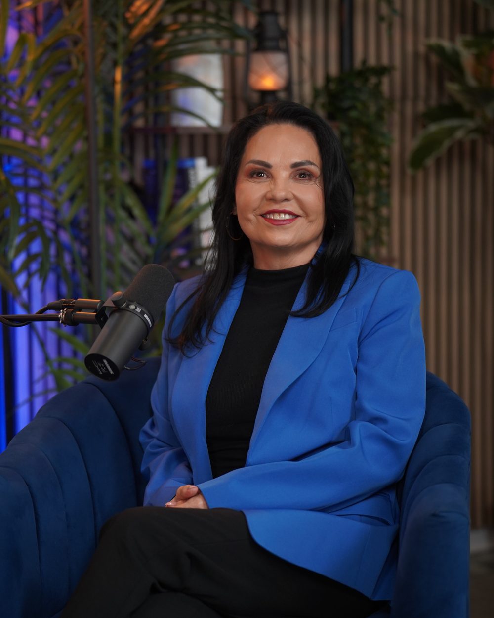 Olivia Ramirez Smith seated in a studio, wearing a blue blazer