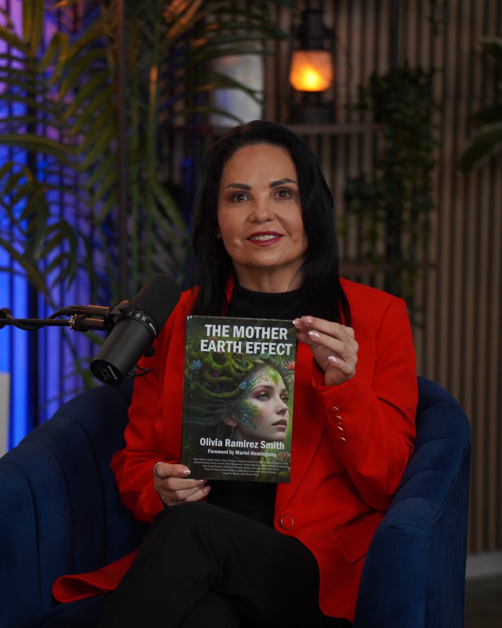 Olivia Ramirez Smith holding her book The Mother Earth Effect